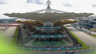 Why is the Bahrain Grand Prix taking place in Malaysia?
